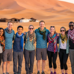 Group of friends in desert landscape student trip